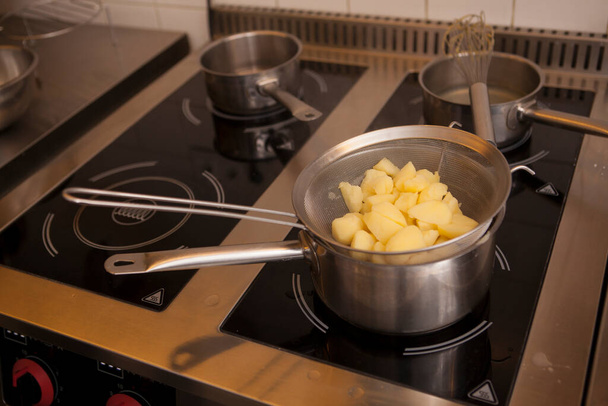 Close up of boiled potatoes in a pan on the stove - Photo, Image