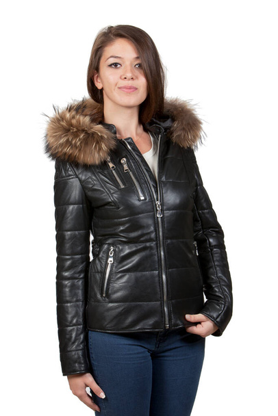Attractive girl with brown hair and well-groomed is promoting a black leather jacket on it. Large size model leather jacket image for e-commerce, online sales, social media. - Foto, Bild