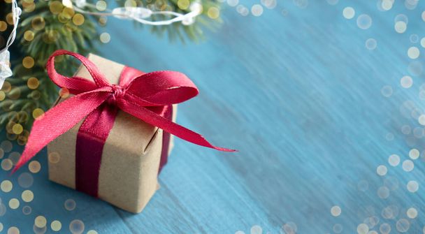 Christmas gift box with of craft paper with green ribbon - Fotoğraf, Görsel