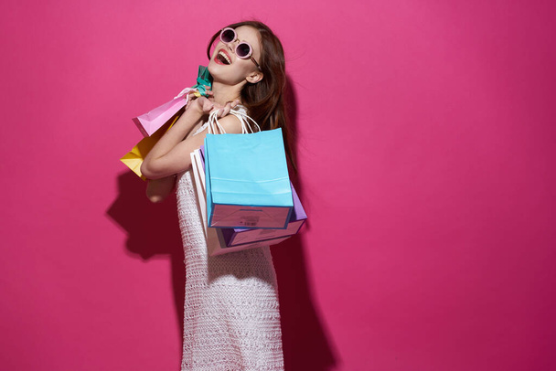 pretty woman with packages in hands Shopaholic isolated background - Valokuva, kuva
