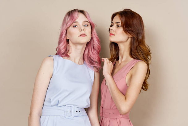 two girlfriends standing side by side posing fashion luxury - Фото, зображення