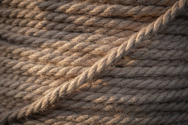 Background with jute rope wound on a spool close-up - Φωτογραφία, εικόνα
