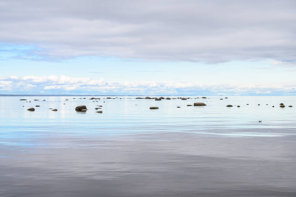 granite boulders in the Gulf of Finland. cloudy gloomy day. - Photo, Image
