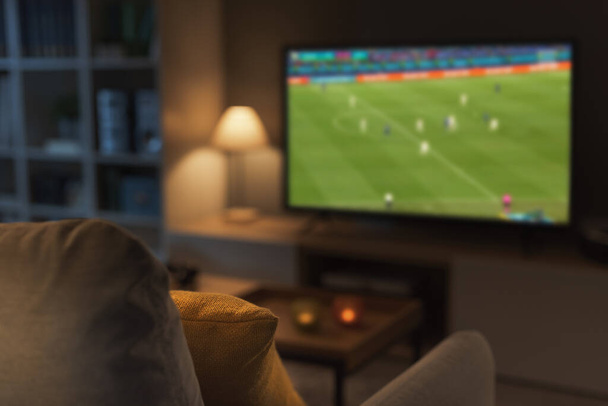 Football match live on TV, sports and entertainment concept - Zdjęcie, obraz
