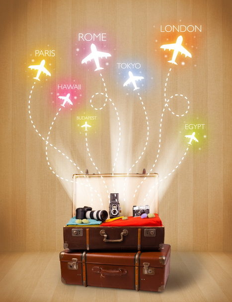 Travel bag with clothes and colorful planes flying out - Photo, Image