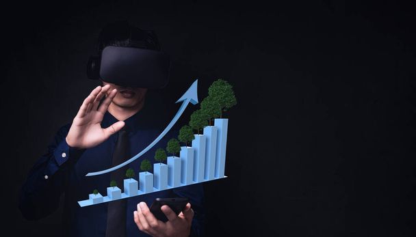 Liikemies käyttäen Virtual Reality Metaverse lasit virtuaalimaailmaan osoittaa baari kuvaaja liiketoiminnan kasvua - Valokuva, kuva