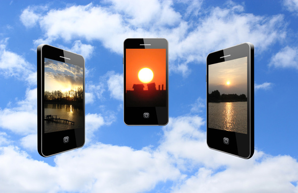 trzy telefony komórkowe z różnych zachody słońca - Zdjęcie, obraz