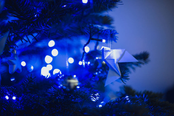 blue Christmas lights white origami baubles original and unusual - Photo, Image