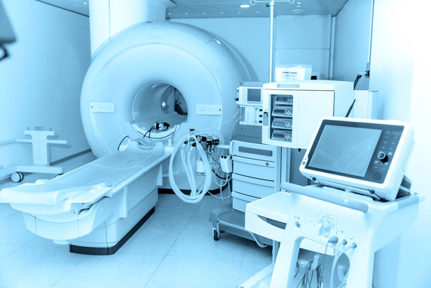 Medical CT or MRI Scan in the modern hospital laboratory. Interior of radiography department. Technologically advanced equipment in white room. Magnetic resonance diagnostics machine - Fotoğraf, Görsel