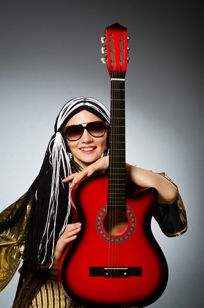 Guitar player with red instrument - Foto, imagen