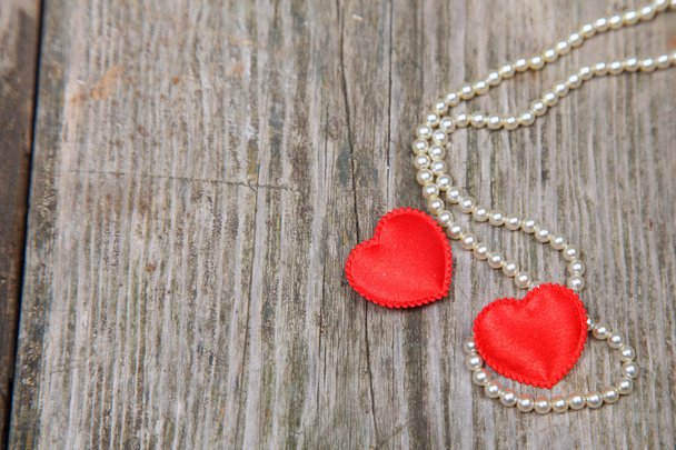 Two red hearts and beads  - Foto, immagini