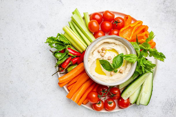 Hummus platter with assorted snacks. - Photo, Image