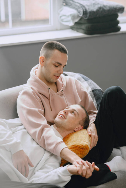 Young romantic gay couple spending day cuddling - Foto, afbeelding
