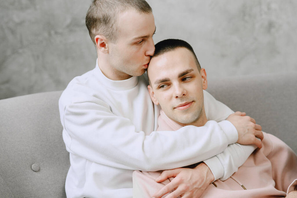 Young romantic gay couple spending day cuddling - Фото, зображення