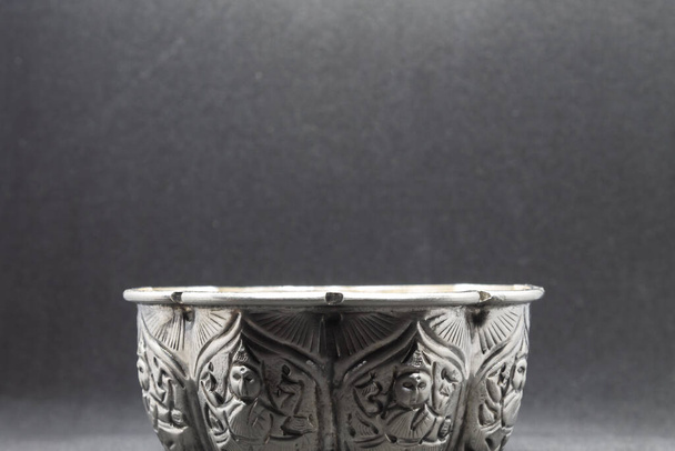 A bowl used in Hindu festivals, engraved with images of god - Photo, Image