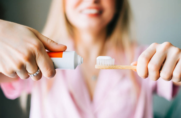 Caucasian cheerful woman holding toothbrush and toothpaste, prepare to cleaning mouth , healthy lifestyle concept. - Fotoğraf, Görsel