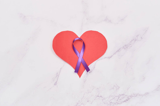 Purple ribbon for World Cancer Day and heart of hope. February 4th. - Valokuva, kuva