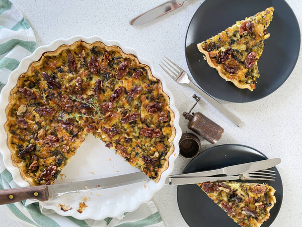 Quiche with ricotta and dried tomatoes in a large white baking dish. - Photo, Image