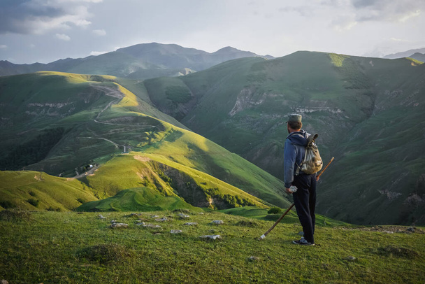 A lonely shepherd on top of a green hill in Dagestan - Fotoğraf, Görsel