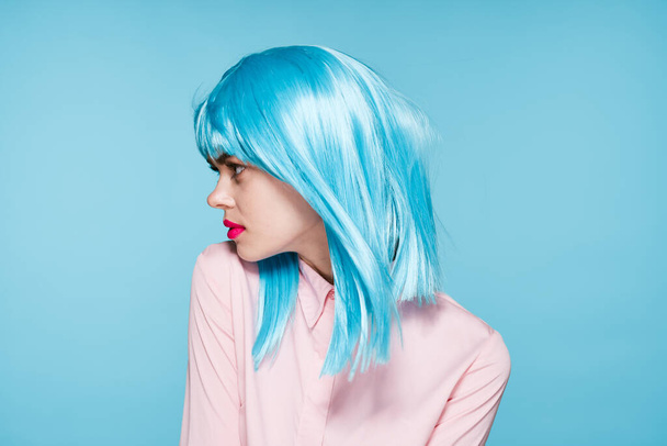 cheerful glamorous woman in pink shirt blue wig makeup model - Fotografie, Obrázek