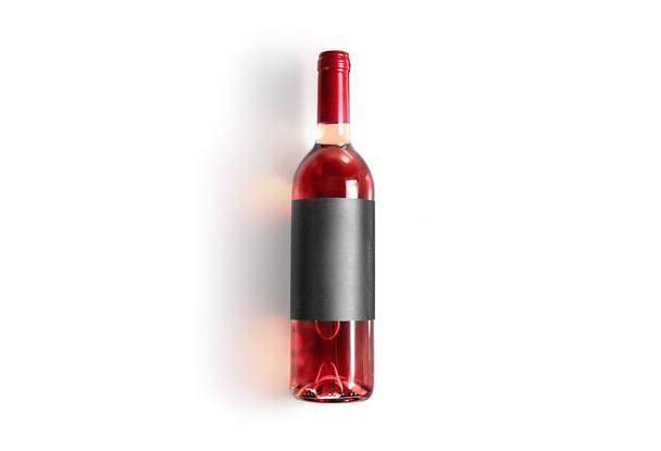Top view of rose wine bottle isolated on white background - Zdjęcie, obraz