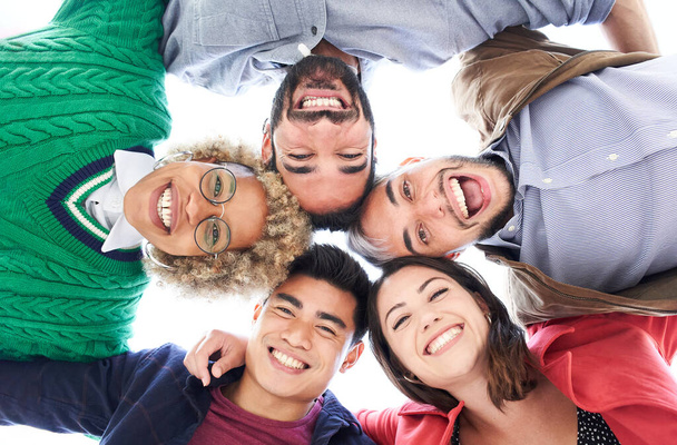 Multiracial group of friends having fun. Group of people standing in circle smiling looking at the camera and laughing. Concept of friendship. - Photo, Image
