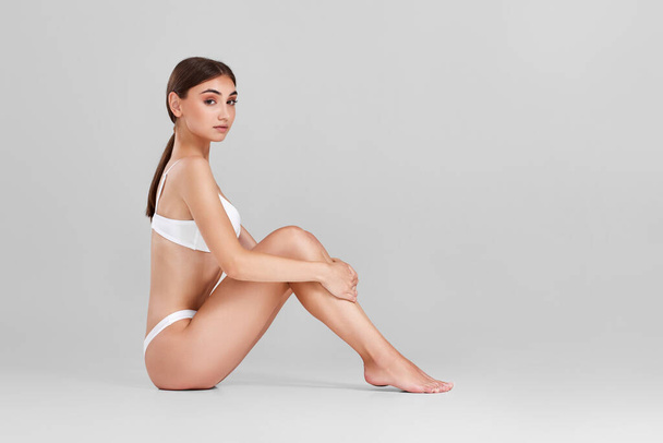 woman with perfect body and legs in white underwear - Zdjęcie, obraz