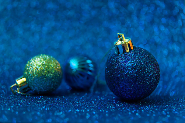 Christmas tree decorations on a shiny background. Vibratory focus. Holiday. - Photo, Image