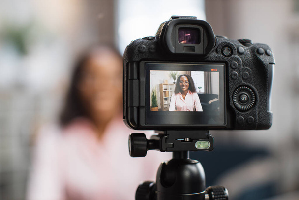 African woman using video camera for live stream - Valokuva, kuva