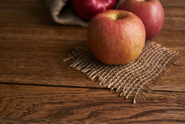 apples on a wooden table vitamins fresh fruits organic - Fotoğraf, Görsel