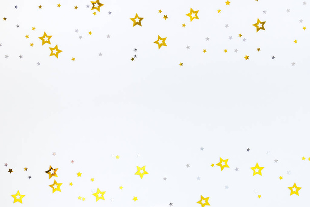 Confetti from stars on a white background. - Zdjęcie, obraz