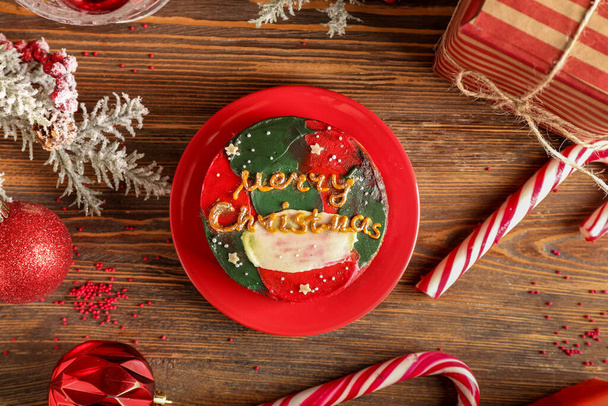 Christmas composition with tasty bento cake on wooden background - Fotografie, Obrázek