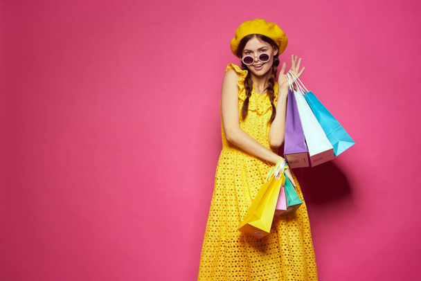 glamorous woman wearing sunglasses posing shopping fashion isolated background - Foto, afbeelding