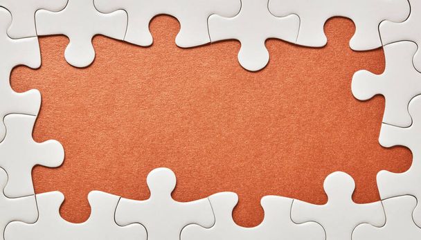 Puzzle pieces on golden background - Photo, Image