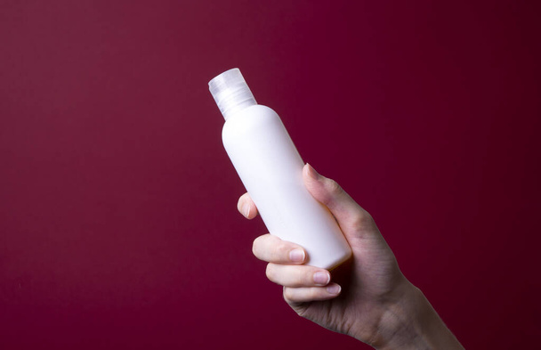 packaging of lotion or hand cream in female hands - Photo, Image