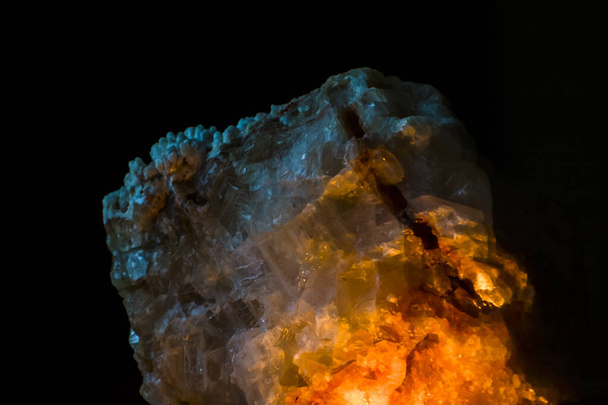 Mineral rock with weak light in the dark - Foto, Imagen