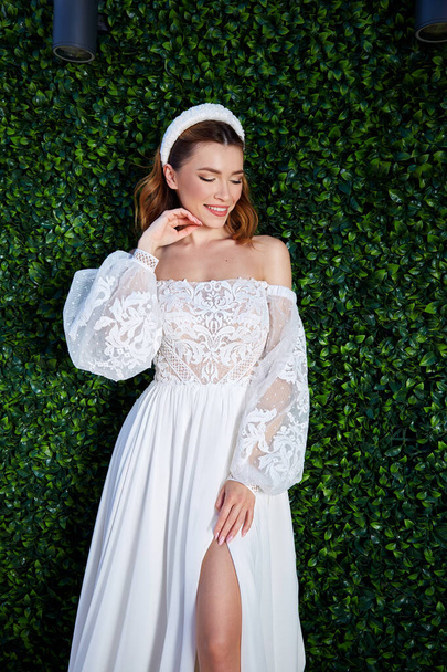 Sexy beautiful brunette woman pretty bride wedding big day marriage ceremony in summer garden wearing long silk and lace white dress bright makeup hairstyle pure love interior. - Fotó, kép