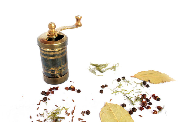 brass mill or grinder and some spices - Photo, Image