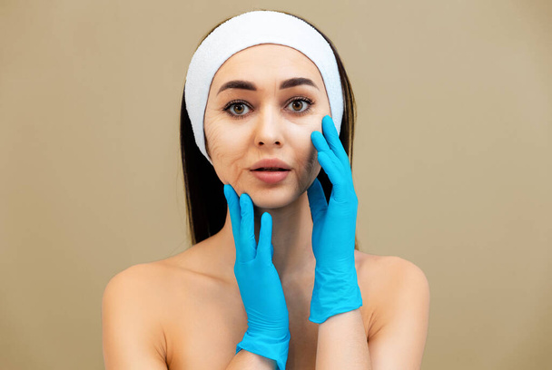 Portrait of an adult woman with a headband and rubber gloves. The concept of aging and rejuvenation. - Фото, изображение