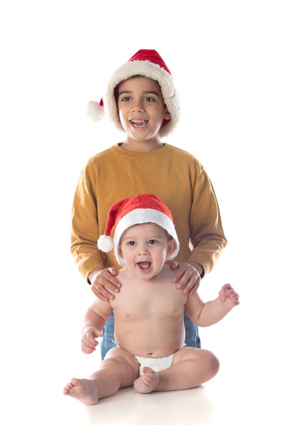 Two happy brother with christmas hat isolated on a white background - Foto, Bild