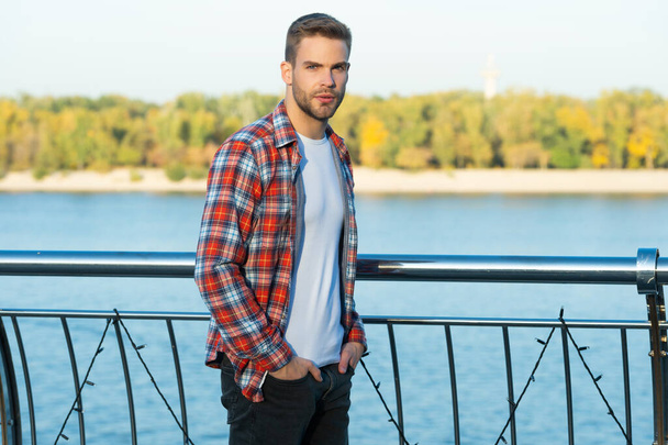 handsome unshaven man in checkered shirt outdoor, fashion-monger - Zdjęcie, obraz