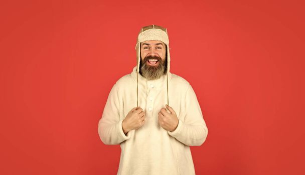 Warm clothes. Modern winter earflap beanie hat. Funky happy bearded man. mature man posing with funny outfit. man beard in winter hat. portrait of trendy guy wearing hat. Male winter style - Photo, image
