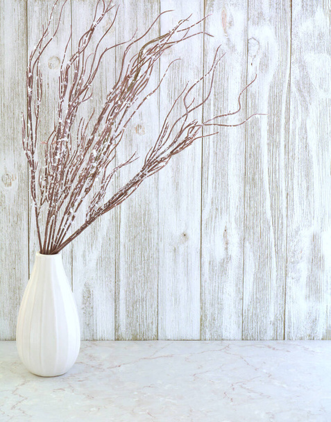 Frosted branches in simple white vase against white weathered boards in vertical format.  Neutral palette still life with room for text. - Photo, Image