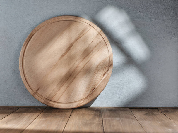 Round kitchen board on the table - 写真・画像