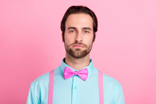 Photo of serious confident young man wear turquoise outfit bewtie isolated pink color background - Photo, image