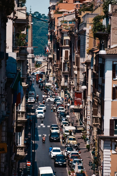 ROME, ITALY - Aug 12, 2021: A beautiful view of a busy street in Rome, Italy during the August - Fotografie, Obrázek