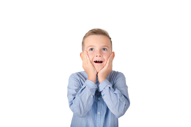 Surprised schoolboy, mouth wide open, stunned by shocking news, on a white isolated background.Copy space,banner,advertisement. - Photo, image