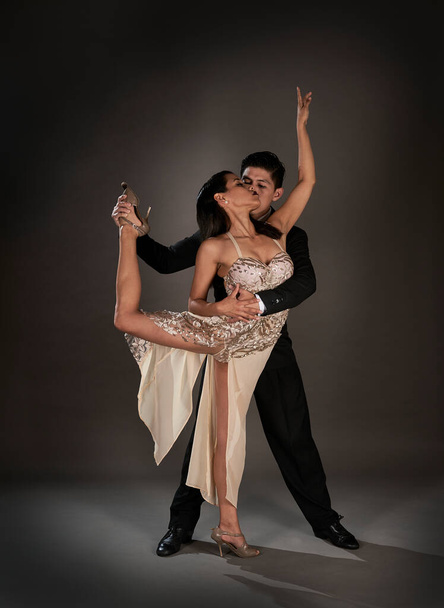 Studio shoot Latin woman and asian man dancing tango ballroom - Φωτογραφία, εικόνα