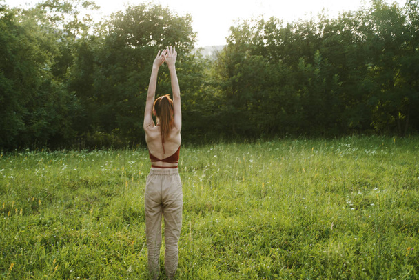 woman exercising outdoors freedom summer nature recreation - Foto, imagen