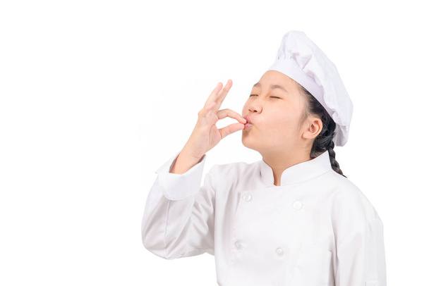 Cute chef girl showing sign for delicious. Kid chef in white uniform with perfect sign. Serious satisfied bearded chef, cook or baker gesturing excellent. Cook with taste approval gesture. - Zdjęcie, obraz
